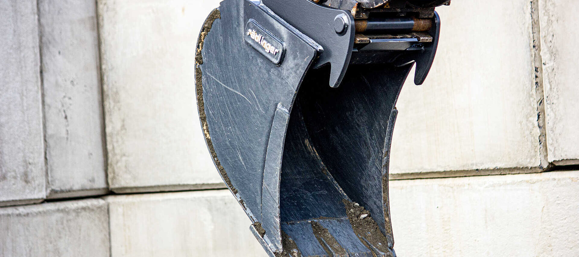 Bucket for excavators by Rädlinger at a construction site