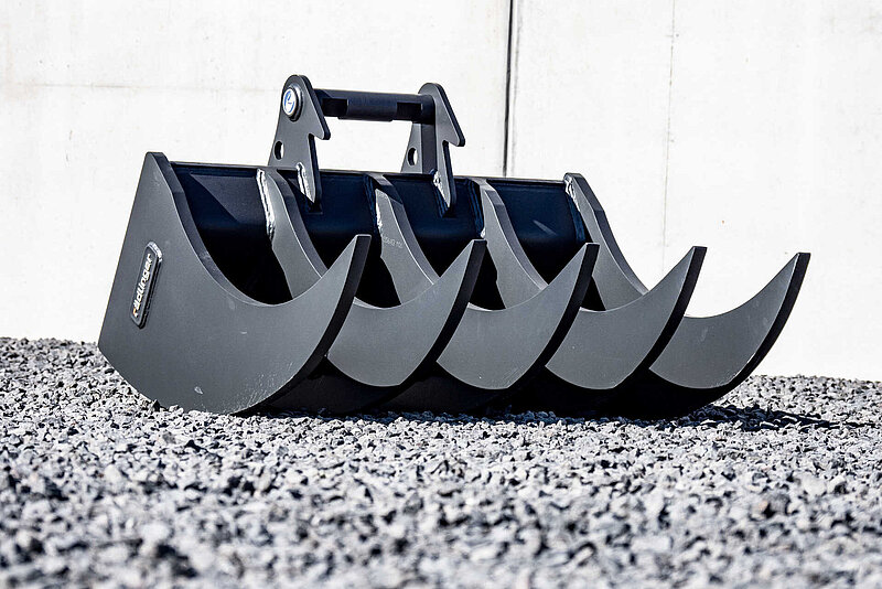 Clearing Rake for excavators lying on stony ground